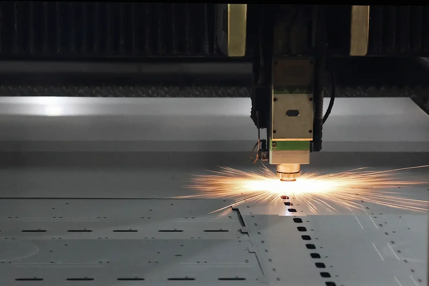Fiber laser cutting machine processing flat metal sheet for custom sheet metal manufacturing