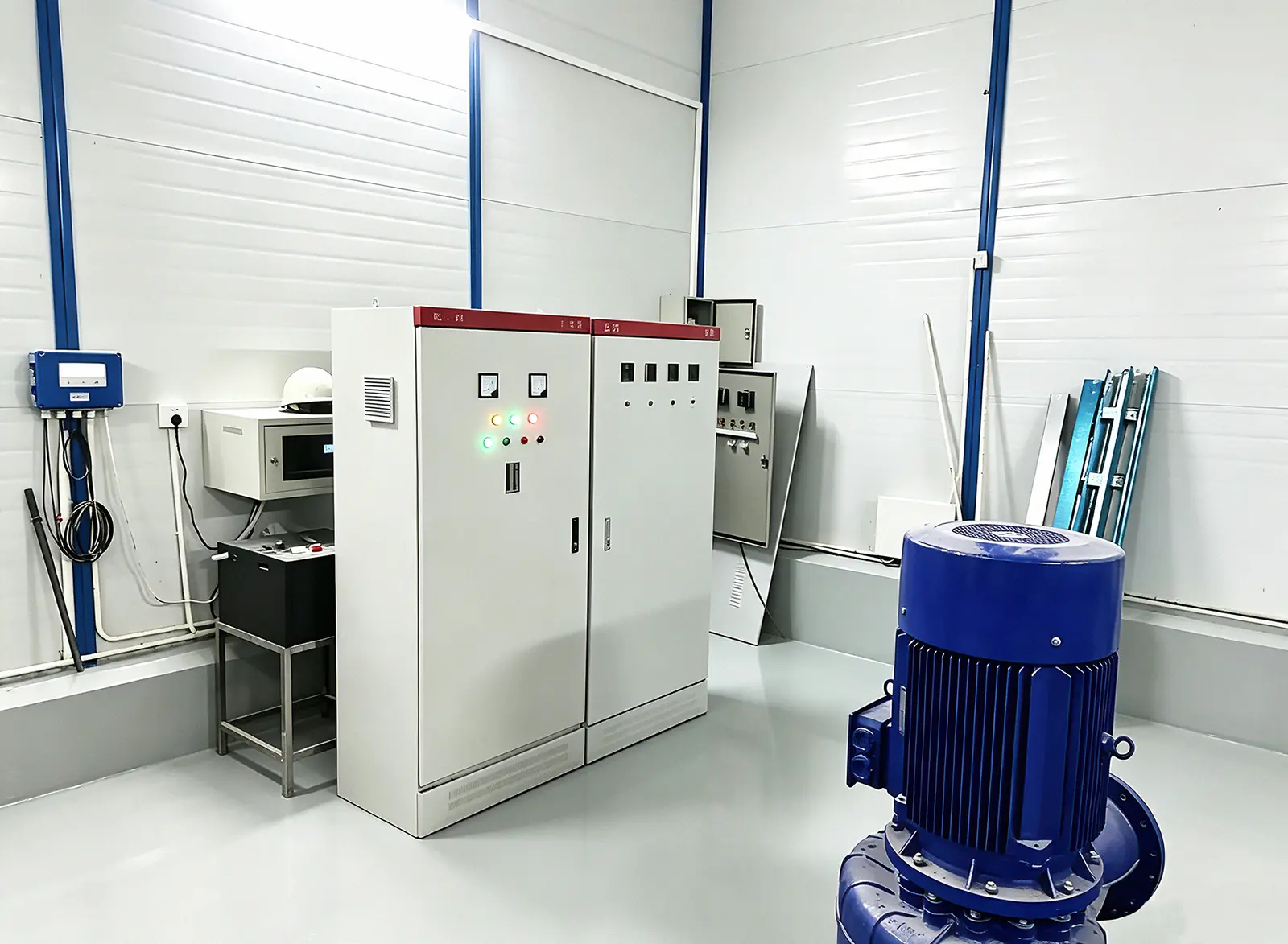 Industrial electrical control cabinet installed inside water treatment plant with water pump motor